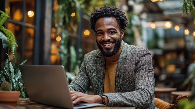 smiling customer service representative efficiently managing client queries on laptop in modern office environment highlighting professionalism and effective communication skills