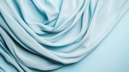 Obraz premium Soft, flowing light blue fabric drapes elegantly, showcasing smooth textures and gentle folds.