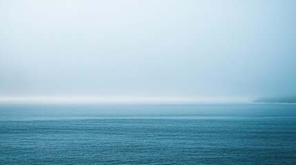 Obraz premium Misty Ocean Vista: A Serene Seascape