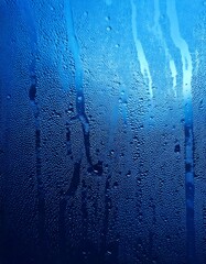 Blue pure water drops, isolated, blue background, realistic rain droplets, dew on glass, smooth reflections, glistening surface, fresh ambiance, soft gradients, transparent clarity.

