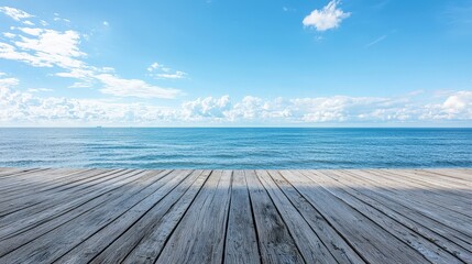 Wooden floor or plank on sand beach in summer, calm sea and blue sky background