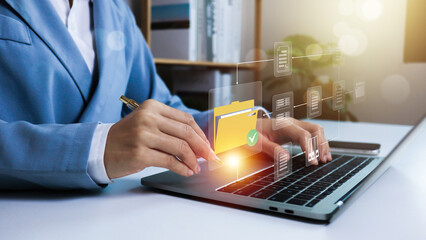 Document Management System (DMS),Businessman using a laptop searching folder and managing files...