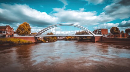 Obraz premium Serene River Scene with Modern Arch Bridge