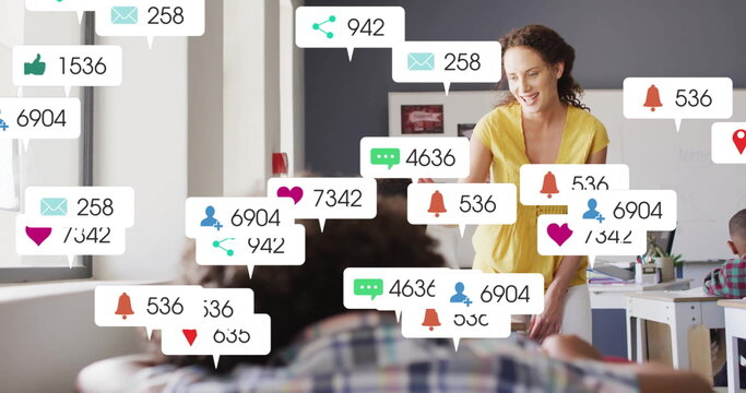 Image of media icons over diverse schoolchildren learning with female teacher