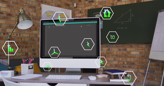 Image of ecology icons over empty office with computer