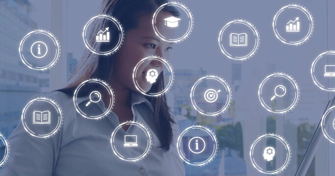 Image of digital icons and data processing over biracial businesswoman in office