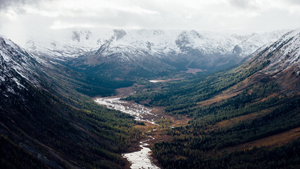 Snow-capped mountains of Oka District, showcasing the pristine and majestic beauty of the winter landscape from an aerial drone perspective