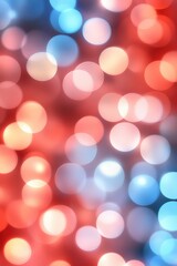 Obraz premium A vibrant background filled with colorful bokeh effects in shades of red and blue, ideal for festive themes, events, or digital design projects needing a lively touch