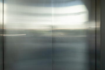 The silver door of an elevator is closed