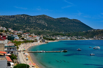 Spile Beach in Himare Bay on the coast of southern Albania, part of the Albanian Riviera. Located in Vlore County, it lies between Ceraunian Mountains and the Ionian Sea and is a major tourism centre