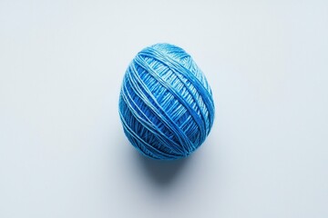 Fototapeta premium Blue Yarn Ball for Knitting Hobby Still Life on a Plain Background