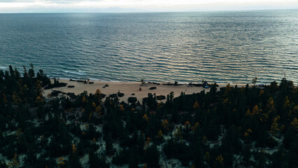 Aerial view of the rugged and serene shoreline of Northern Lake Baikal, highlighting its untouched...
