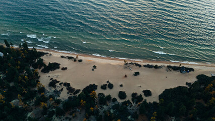 Aerial view of the rugged and serene shoreline of Northern Lake Baikal, highlighting its untouched...
