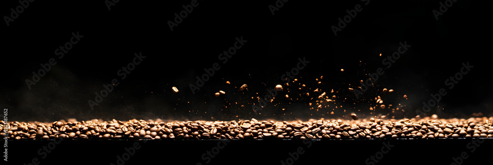 Canvas Prints coffee beans being roasted - with the beans in mid-air and motion blur emphasizing the process wide 