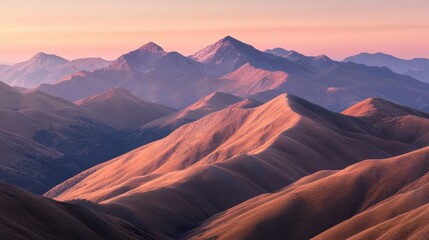 Naklejka premium Majestic mountains bathed in the soft light of dawn create a serene landscape, This image can be used for travel brochures, nature websites, or as backgrounds for relaxation themes,