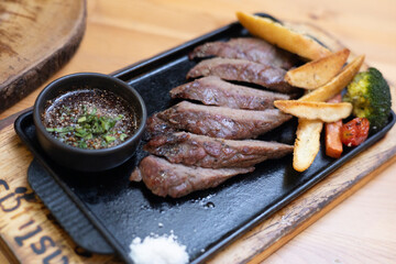 Steak meat beef food dinner grill roast plate, beefsteak cooking kitchen rib. Steak beef grilled meat sizzling hotplate black iron pan, tender, juicy, protein, cooked medium or rare.