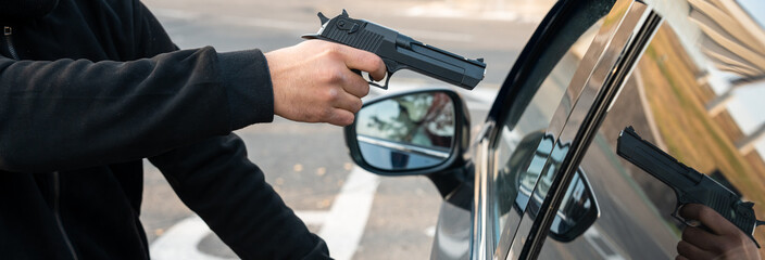 Kidnapping attempt from a car, masked criminal points a gun at the driver