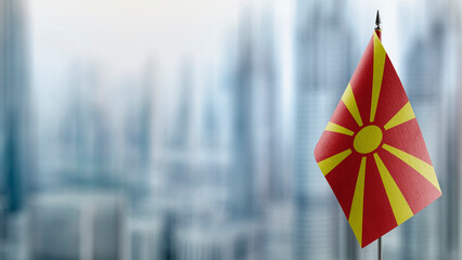 Small flags of the Macedonia on an abstract blurry background