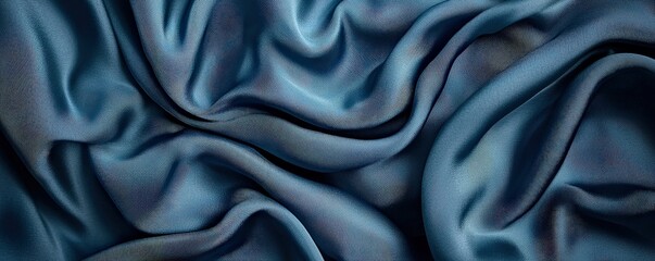 Fototapeta premium Customer experience interaction data concept. Textured blue fabric with intricate patterns and folds.