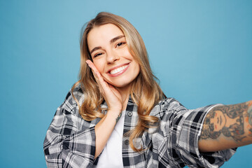 Close up young smiling cute woman she wear checkered grey shirt casual clothes doing selfie shot...