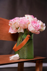 delicate pink roses, flowers, spring flowers, bouquet, green vase, flowers in a vase ,chair, bench, wooden bench
