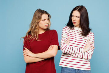 Young offended couple two friends women wear red casual clothes together hold ands crossed folded...
