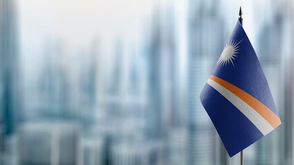Small flags of the Marshall on an abstract blurry background