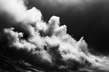 Obraz premium Dramatic black and white image of a massive, turbulent cloud formation against a dark sky, resembling a wave crashing.