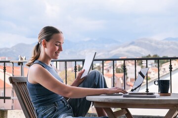 Work Remotely, Digital Nomad.digital nomad enjoys peaceful remote work setup balcony with a scenic...