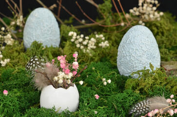 Easter decoration, postcard: ceramic, blue eggs, eggshell, moss, feathers, twigs and baby's breath...
