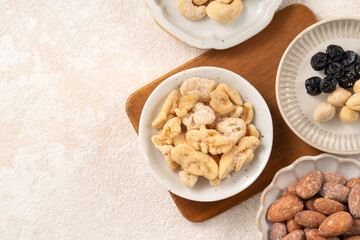 Flavored mixed nuts in bowls.