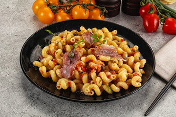Italian pasta cellentani with anchovy