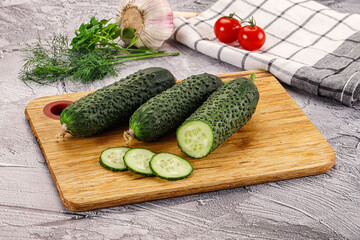 Raw green cucumbers with slices