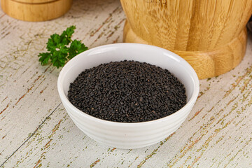 Black dry Nigella seeds in the bowl