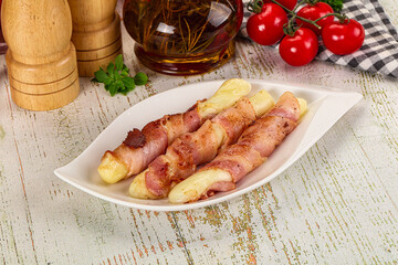 Hot mozzarella sticks with bacon