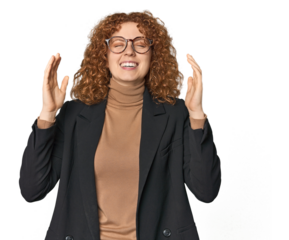 Young Caucasian redhead in business attire joyful laughing a lot. Happiness concept.