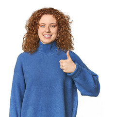 Young Caucasian redhead woman smiling and raising thumb up