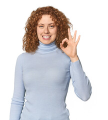Young Caucasian redhead woman cheerful and confident showing ok gesture.