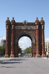 Arc de Triomf in Barcelona, full frontal view. Architectural monument, historic landmark, and a tourist destination