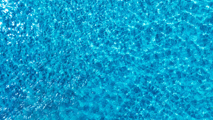 Top view beach sand background for summer vacation concept. Beach nature and summer seawater with sunlight light sandy beach Sparkling sea water 