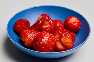 plate of strawberries on a table