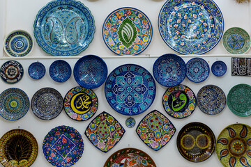  Uzbek ceramic tableware. Decorative ceramic plates and cups with traditional ornament. 