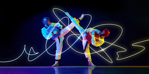 Two taekwondo fighters in synchronized high kicks, protective gear on, yellow neon trails swirling...