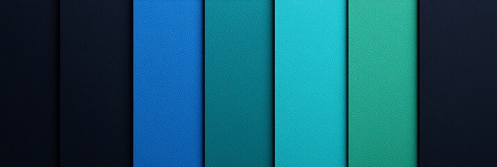 Obraz premium A vibrant arrangement of vertical color stripes in shades of blue and green, showcasing a smooth gradient effect on a dark background.