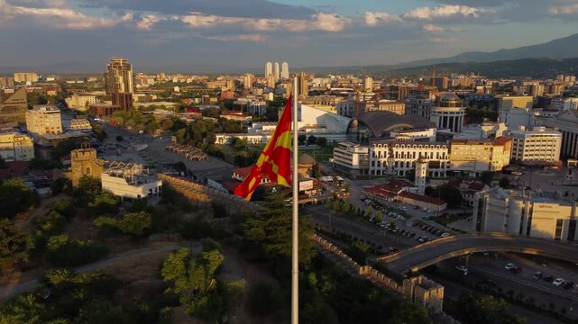 Aerial view of North Macedonian Flag blowing in the wind above Skopje fortress