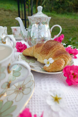 Elegant Outdoor Tea Time with Croissant