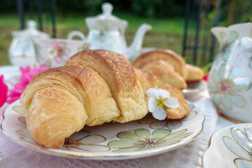 Elegant Outdoor Tea Time with Croissant
