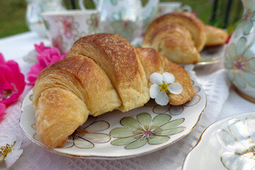 Elegant Outdoor Tea Time with Croissant
