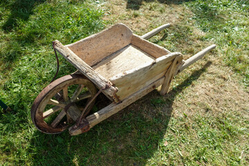 Antique Wooden Wheelbarrow on Grass