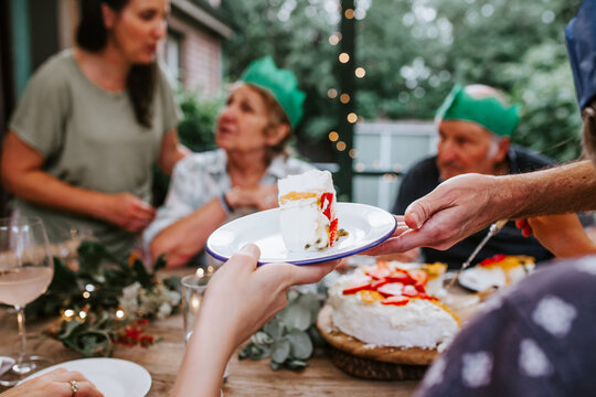 A slice of pavlova on a plate as a dessert for Christmas dinner